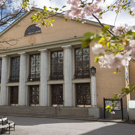 Building at Lorensberg with tree blossom in the foreground