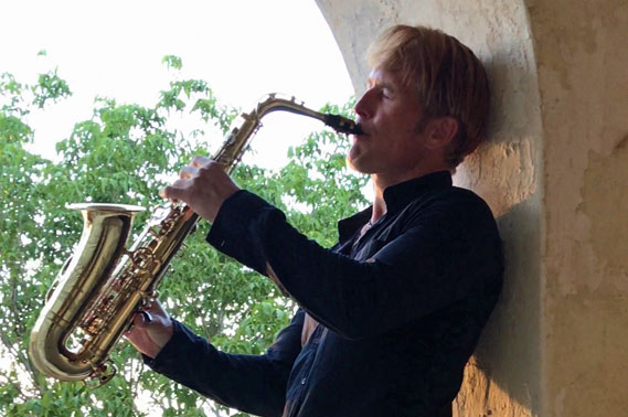 person playing a saxaphone